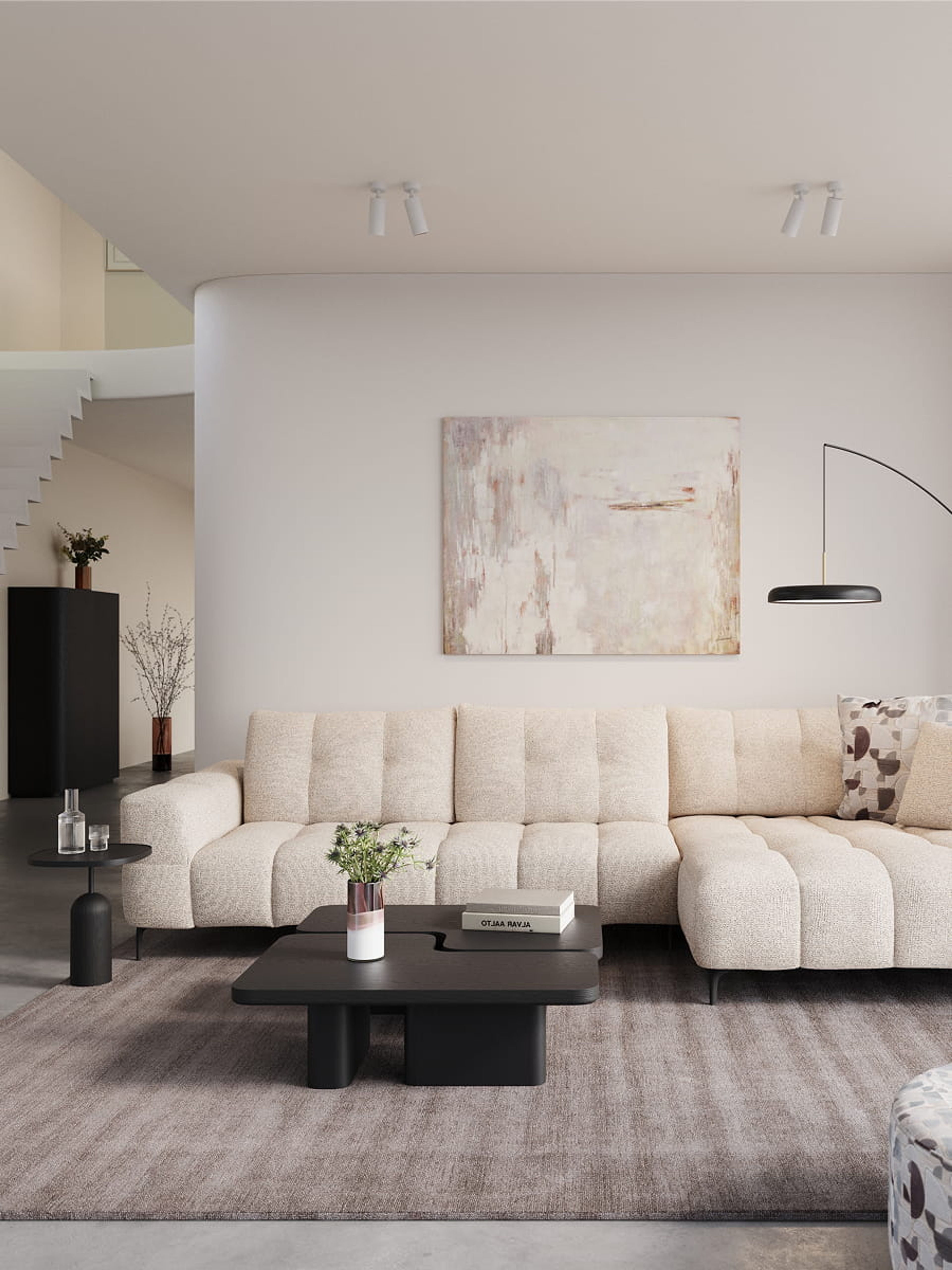 Canapé d’angle Campo beige avec assise profonde dans un salon moderne avec table basse noire, lampadaire et tons neutres.