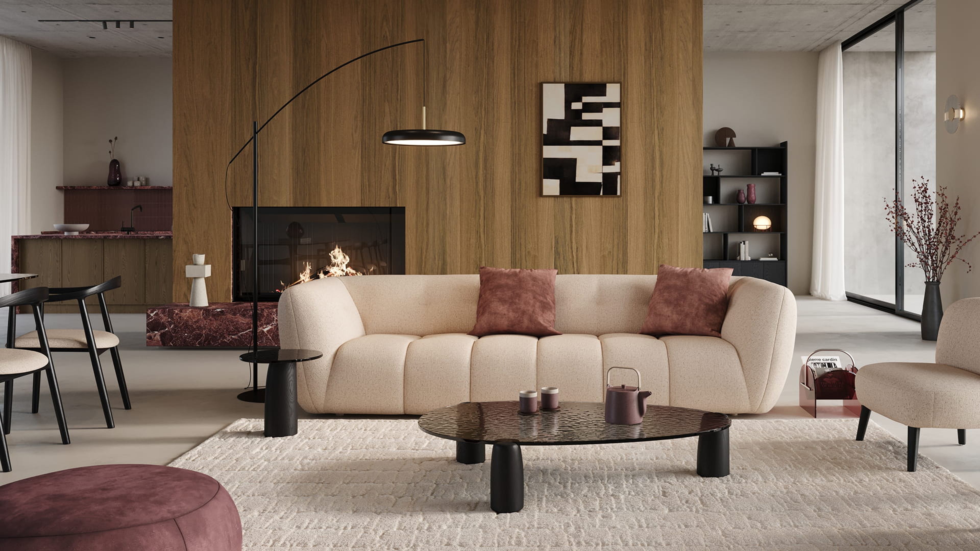 Canapé Chubbi beige aux formes arrondies dans un salon moderne avec mur en bois, cheminée, table basse et lampe design.