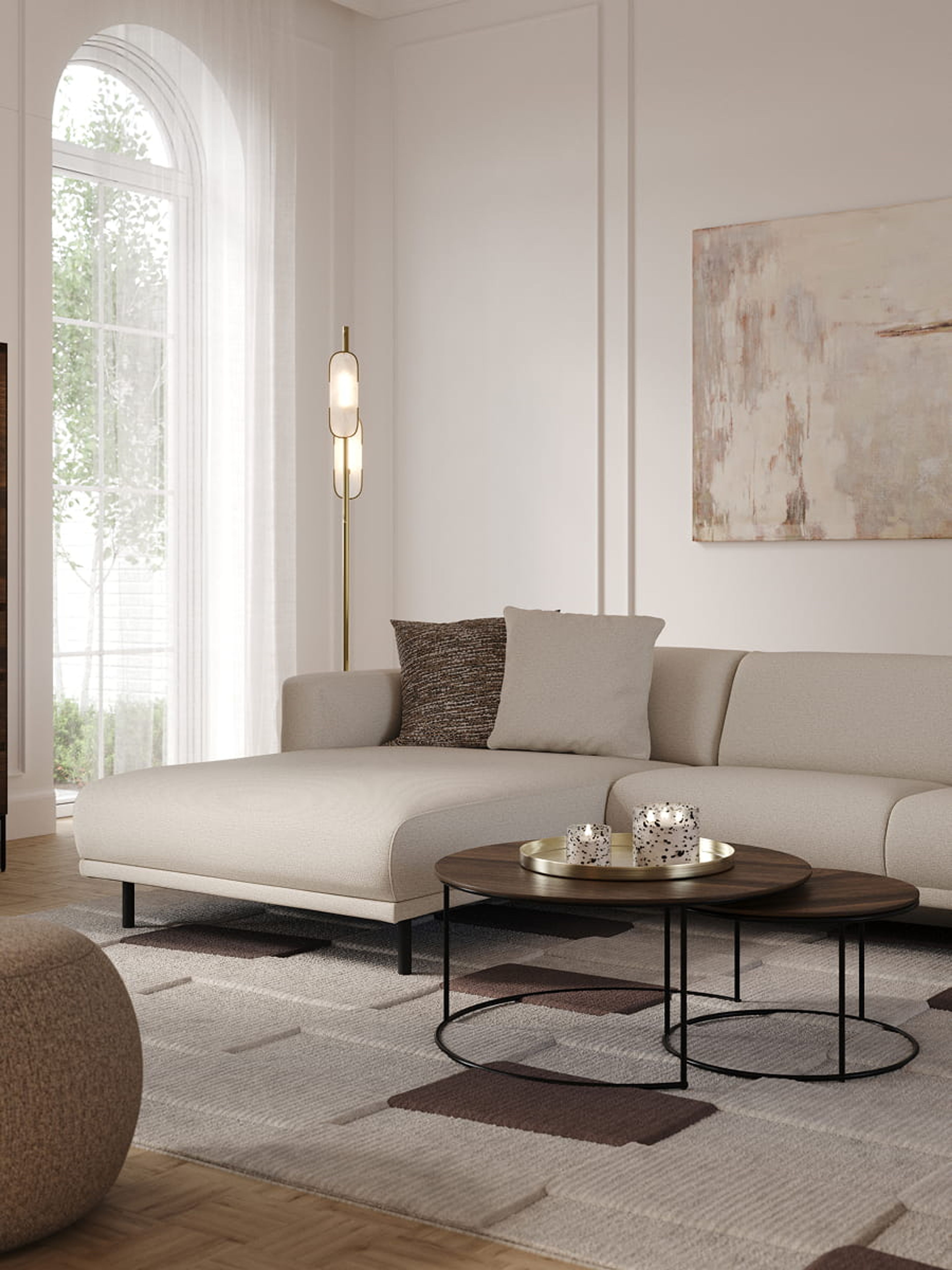 Interieur met lichtbeige hoekzetel, ronde salontafels en Ragusa tapijt met geometrisch patroon in neutrale tinten.