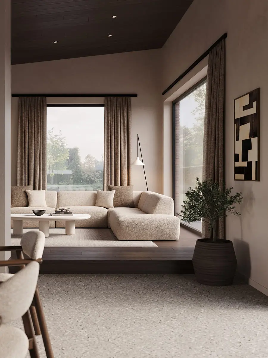 Beige hoekzetel Porto in warme woonkamer met grote ramen, lichte gordijnen, ronde salontafel en houten vloer.