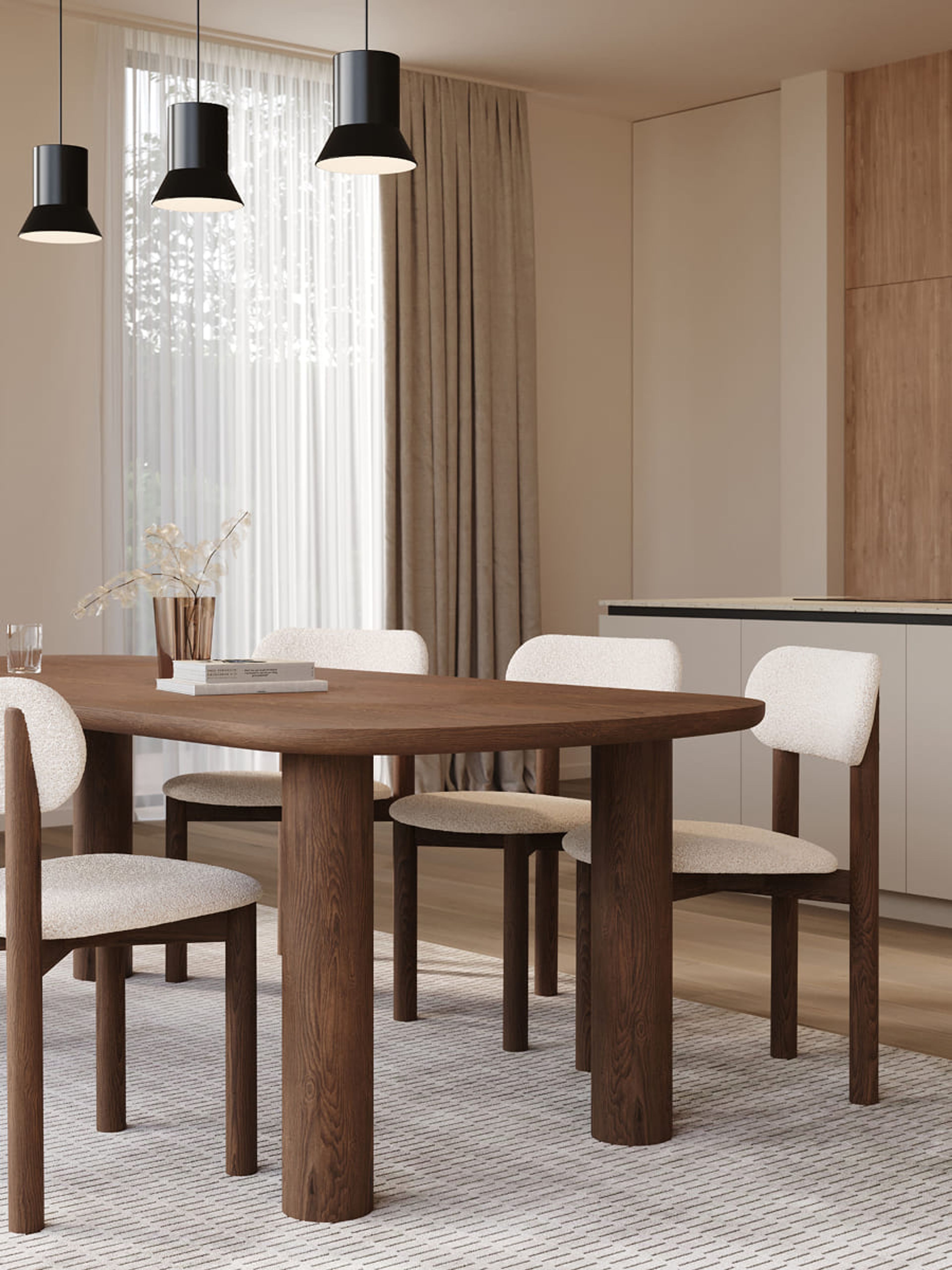 Amici eettafel in hout met zacht gevormd blad en stevige poten, een warm en eigentijds design in een lichte eetkamer.