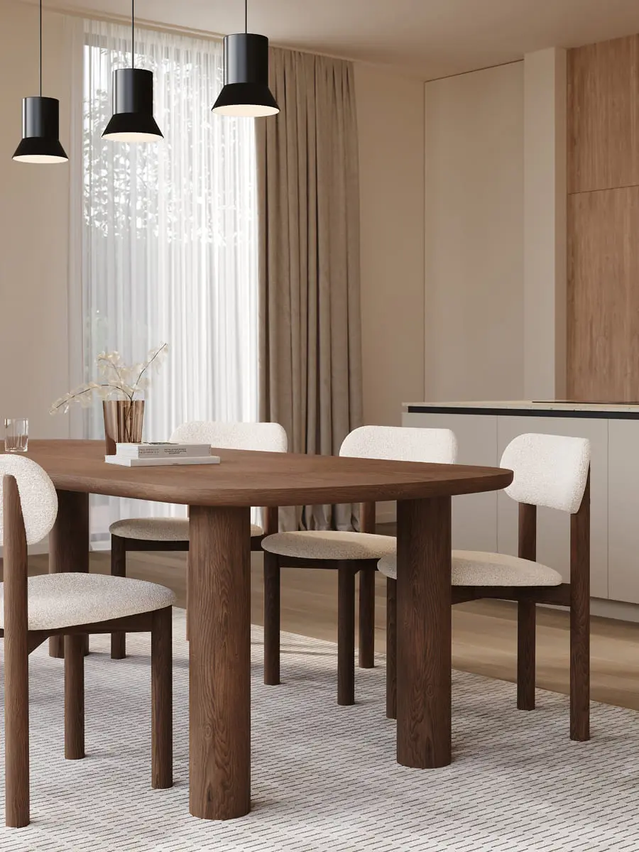 Amici eettafel in hout met zacht gevormd blad en stevige poten, een warm en eigentijds design in een lichte eetkamer.