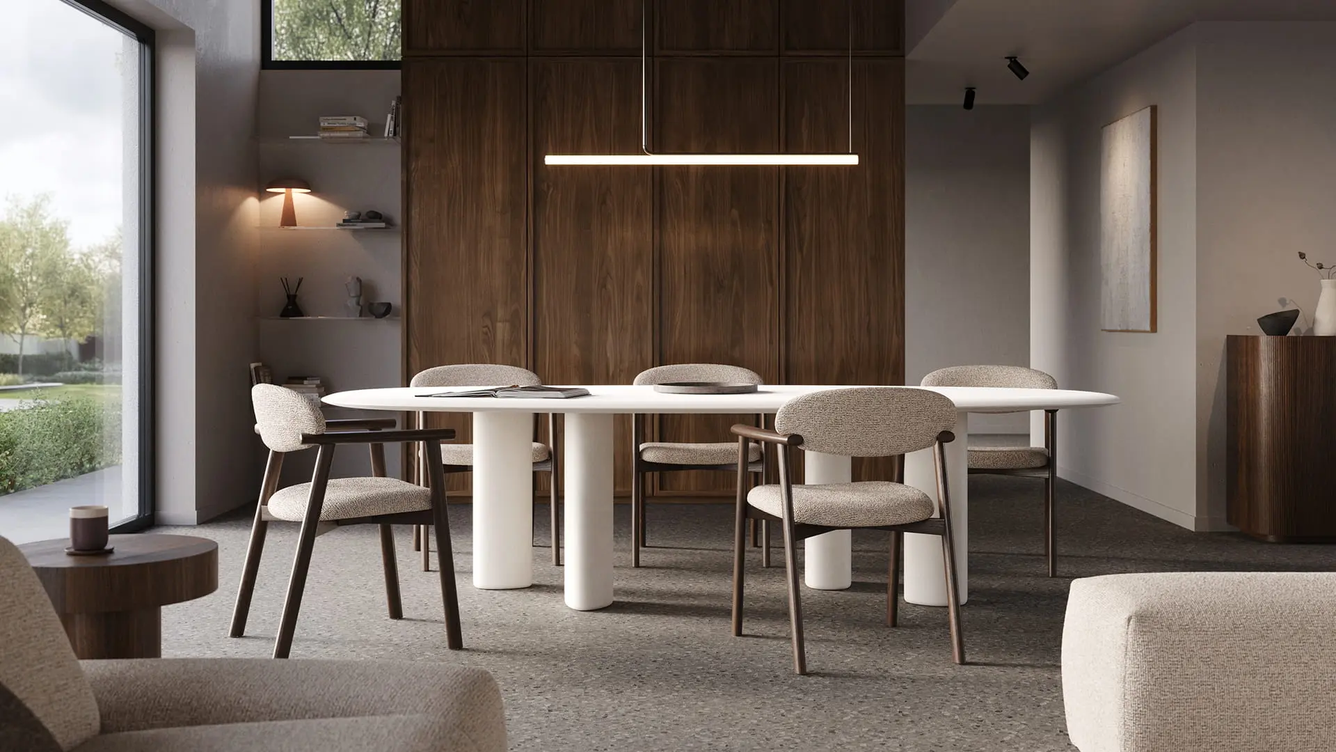 Witte Volanto eettafel met cilindervormige poten en zes gestoffeerde stoelen onder een lineaire hanglamp.