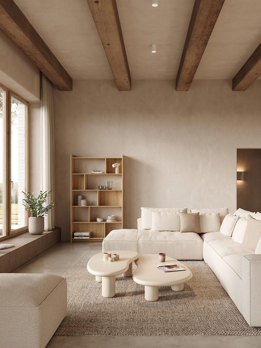 Beige Lavora tapijt in een rustige woonkamer met modulaire zetel, organische salontafels, houten rek en zacht natuurlijk licht.