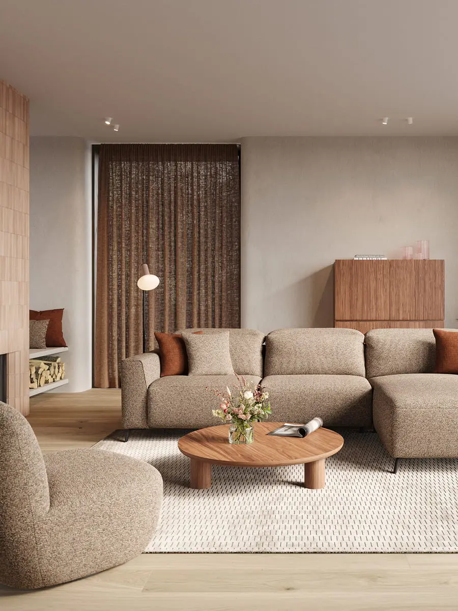 Beige modulaire zetel Monza met chaise longue in warme woonkamer, ronde houten salontafel en kussens.