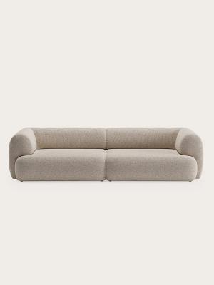 Canapé 2 places Tortona avec accoudoirs et dossier arrondis, recouvert de tissu beige clair.
