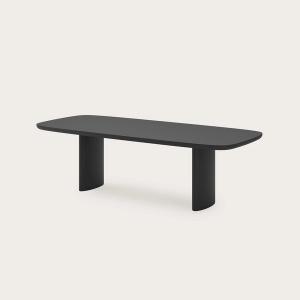 Table à manger Amato en bois noir avec des coins arrondis, plateau allongé et deux pieds larges et arrondis.
