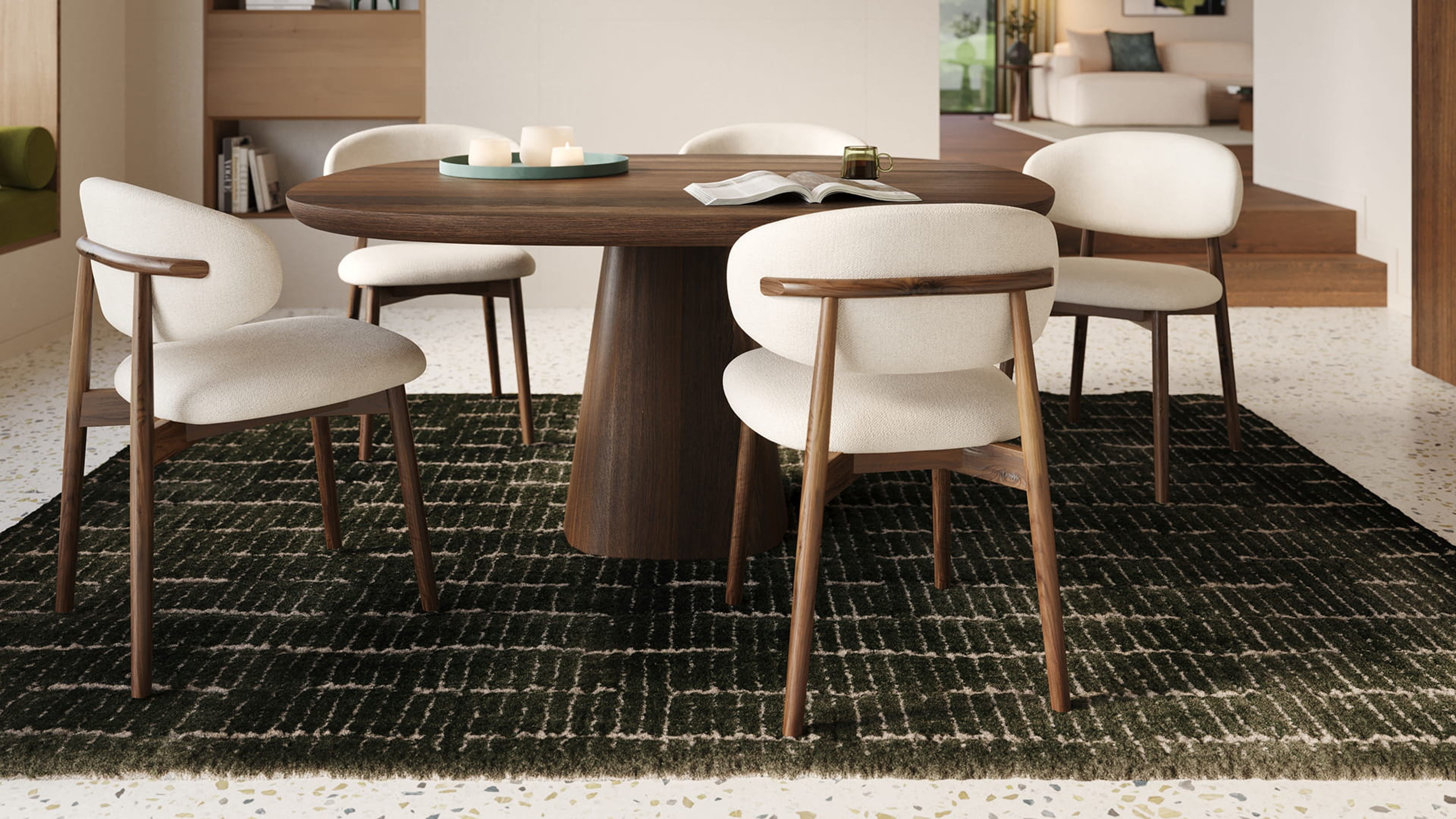 Piola stoel met houten frame en licht gestoffeerde zitting rond een ronde houten eettafel in een warm, modern interieur.