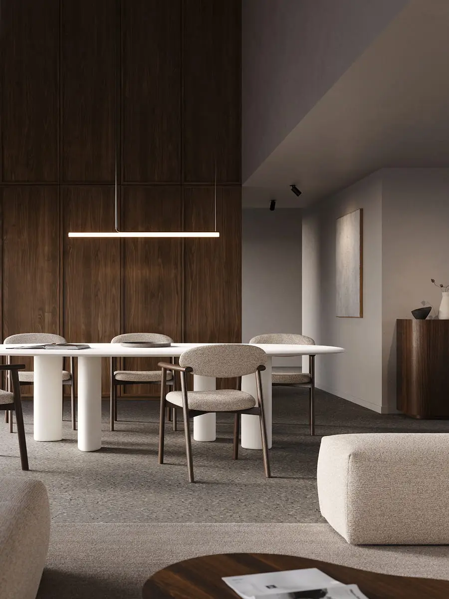 Witte Volanto eettafel met cilindervormige poten en zes gestoffeerde stoelen onder een lineaire hanglamp.