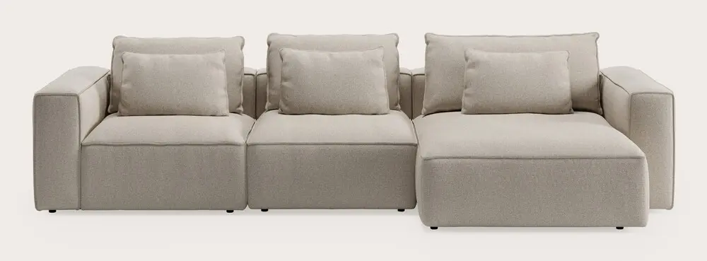 Canapé modulaire Duomo avec trois modules d’assise et coussins en tissu beige clair sur fond neutre.