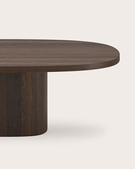 Stadiumvormige eettafel in donker hout met centrale cilindervormige poot.