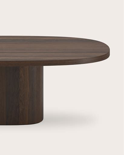 Stadiumvormige eettafel in donker hout met centrale cilindervormige poot.