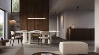 Coin repas moderne avec table ovale blanche, chaises tapissées, armoires en bois et suspension minimaliste.