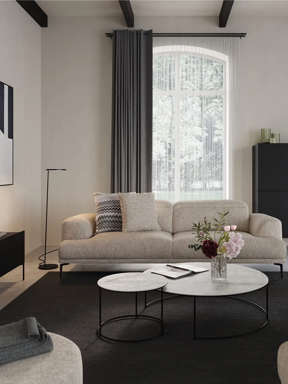 Juno salontafels in zwart op een tapijt voor een beige modulaire zetel in een modern interieur.