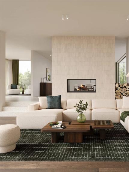 Canapé modulaire Faro beige dans un salon lumineux avec cheminée, tables basses en bois, tapis vert et grandes fenêtres.