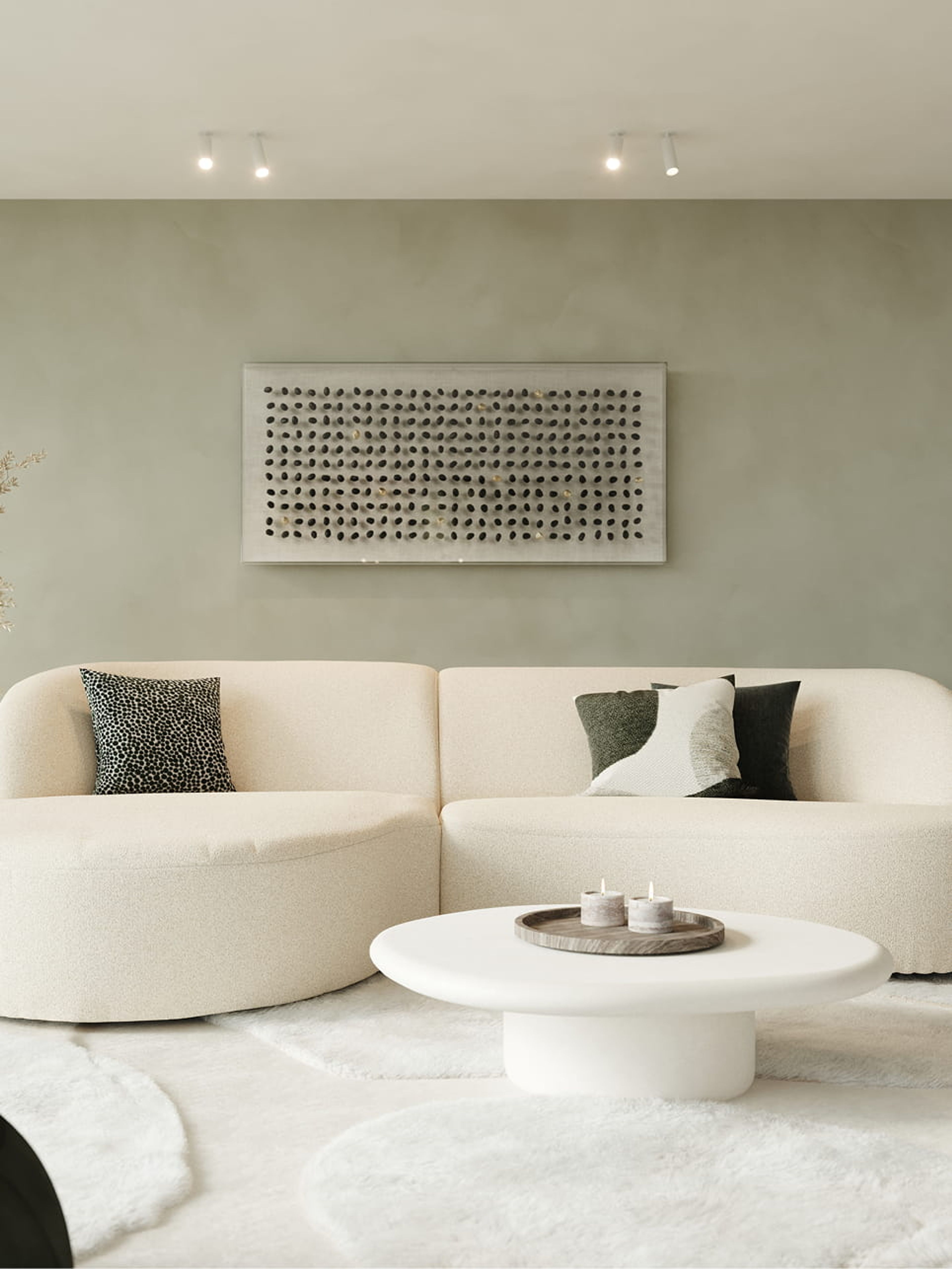 Artisano pebblevormige salontafel in wit voor een beige modulaire zetel in een rustig, modern interieur.